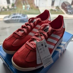 Adidas Red Sneakers with White Stripes